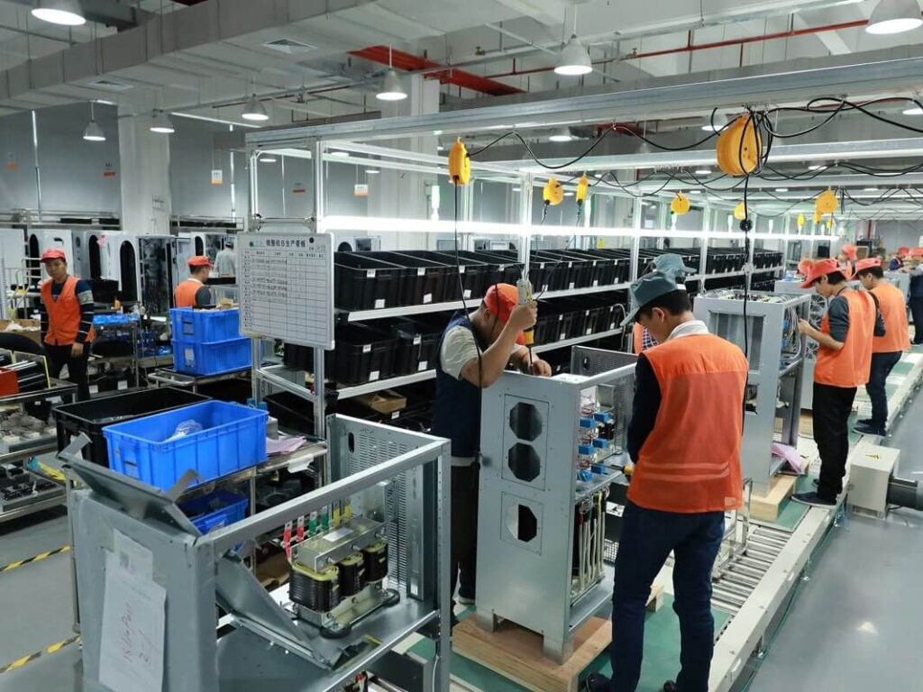 ups-power-supply-factory-worker-working UPS power supply worker is working in factory